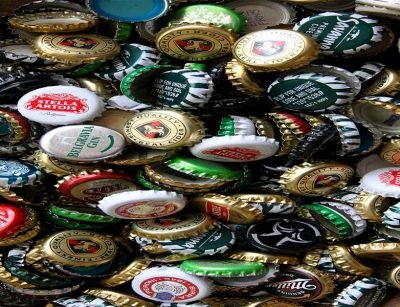 A picture covered in different beer tops with the logos of the different companies on them. Image for the blog post: What you need to know about trademark